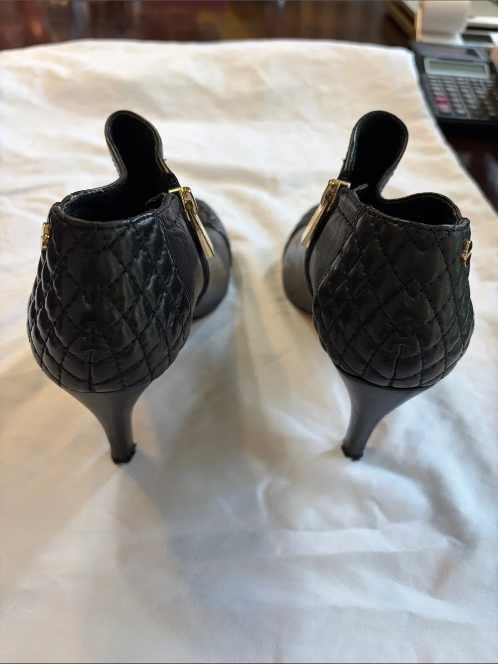 Vince Camuto Black Quilted Cap-Toe Leather Ankle Booties with Gold Zipper